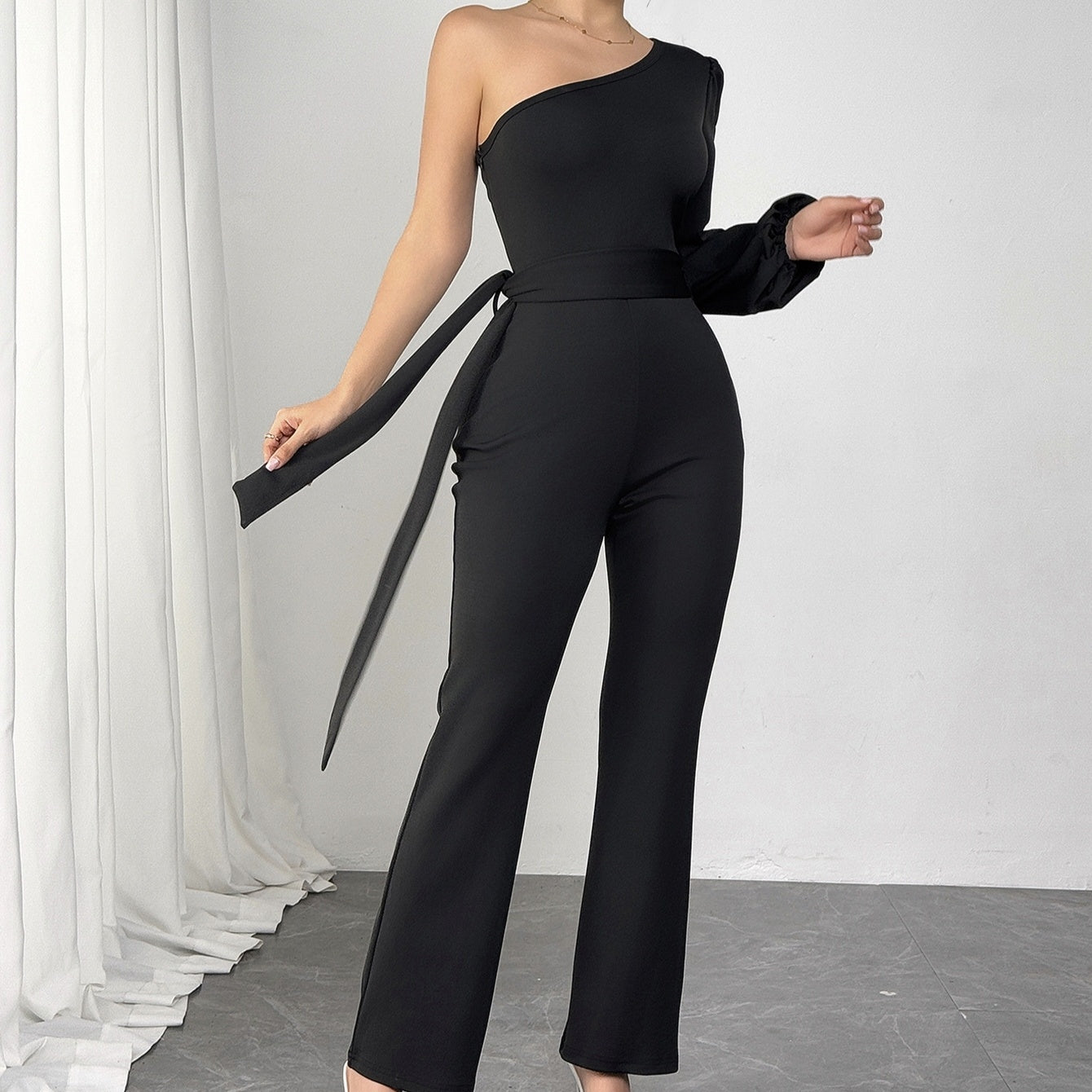 Sleek and Slimming Silhouette Black One-Shoulder Jumpsuit with Side Tie Detail