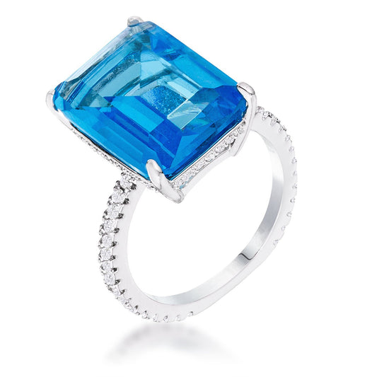 Bring your look to life with this head-turning cocktail ring! Brimming with 15Ct of artfully placed Cubic Zirconia stones, this Rhodium-plated 1mm pave band is designed to highlight its eye-catching center: a magnificent, 13mm x 9mm aqua blue emerald cut stone. A must-have sparkling accent piece to your wardrobe! Base Metal: Brass Style: Cocktail Materials: Cubic Zirconia Color: Light Blue Plating Color: Silvertone  SHIP FROM : USA SHIP TO : USA, CANADA